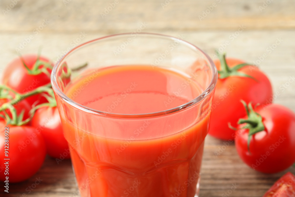 Fresh tomato juice in glass on table, closeup Fresh tomato juice in glass on table, closeup