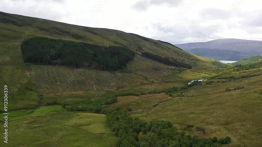 Aerial View of Fleet of Helicopters Flying Into Glen Douglas Valley With Loch Lomond in Distance. Scottish Highlands, Scotland, United Kingdom Aerial View of Fleet of Helicopters Flying Into Glen Douglas Valley With Loch Lomond in Distance. Scottish Highlands, Scotland, United Kingdom