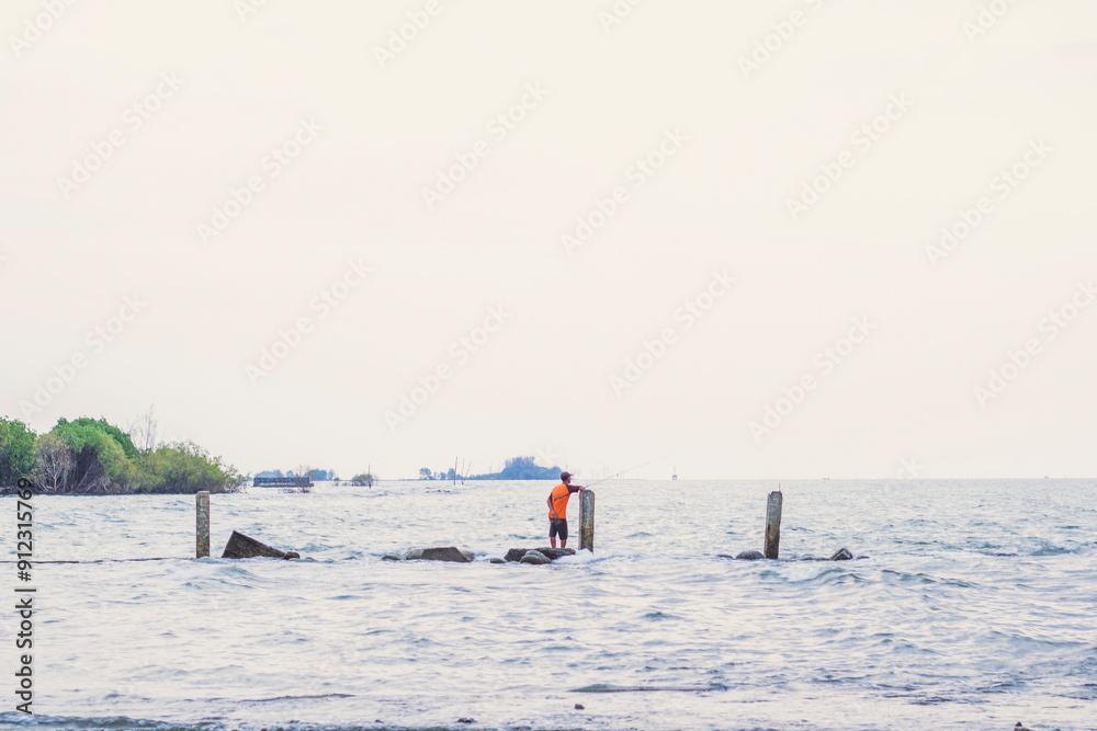 Naklejka premium people fishing in the sea