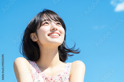 Japanese woman smile enjoying sun during summer vacation, mental health