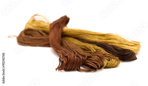 Cotton embroidery thread hanks in different colors, isolated on white background
 photo