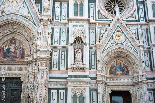 Decorative detail shot of religious images and murals on the bell tower (Giotto's Campanile) of Florence Cathedral, Italy