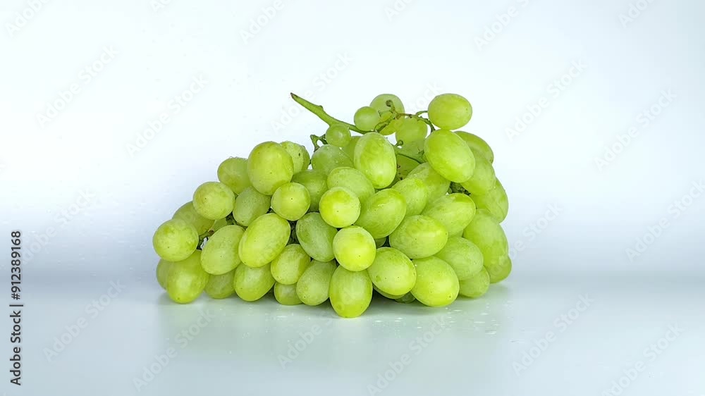 Isolated grapes bunch. Green or yellow grapes with leaves isolated on white background Isolated grapes bunch. Green or yellow grapes with leaves isolated on white background