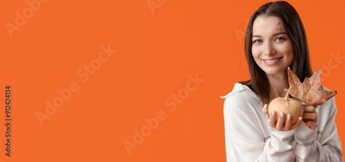 Pretty young woman holding ...