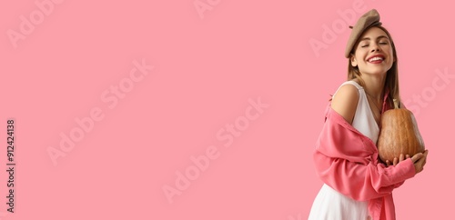 Pretty young woman holding ...