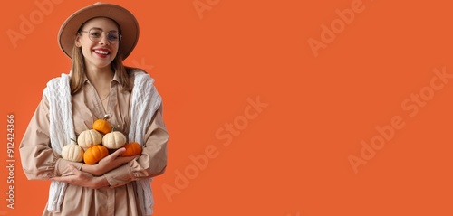 Pretty young woman holding ...