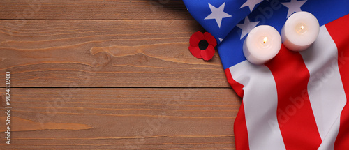 USA flag and candles on woo...