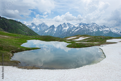 Reflections in a glacial lake. Reflection of the lake on the mountain. Beautiful mountain landscapes in Mestia Georgia. in the Caucasus  
Reflection of Koruldi lake and Caucasus mountains. Georgia. photo