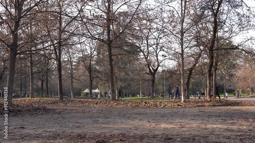 Footage of people walking and relaxing in Indro Montanelli gardens, Porta Venezia district, Milan, Italy, in winter season, daylight, fixed frame, Milan, Italy photo