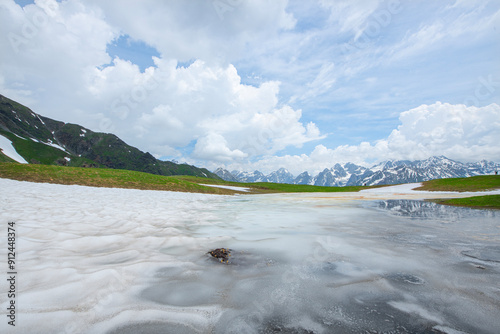 Reflections in a glacial lake. Reflection of the lake on the mountain. Beautiful mountain landscapes in Mestia Georgia. in the Caucasus  
Reflection of Koruldi lake and Caucasus mountains. Georgia. photo