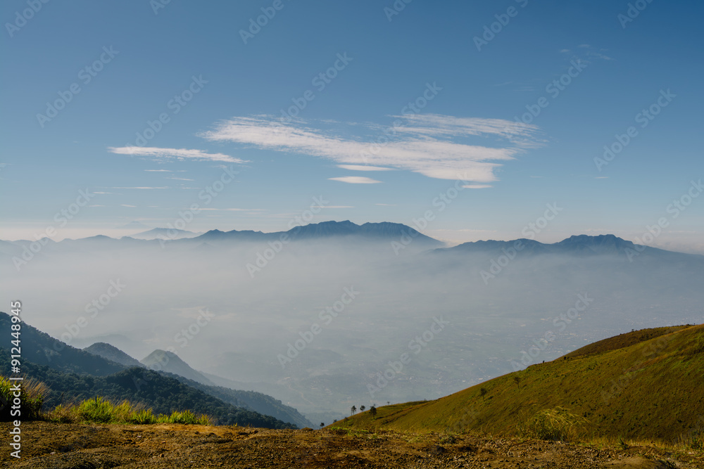 Beautiful and amazing view of the sea of clouds and mountains, taken from the top of Mount Guntur, Indonesia Beautiful and amazing view of the sea of clouds and mountains, taken from the top of Mount Guntur, Indonesia