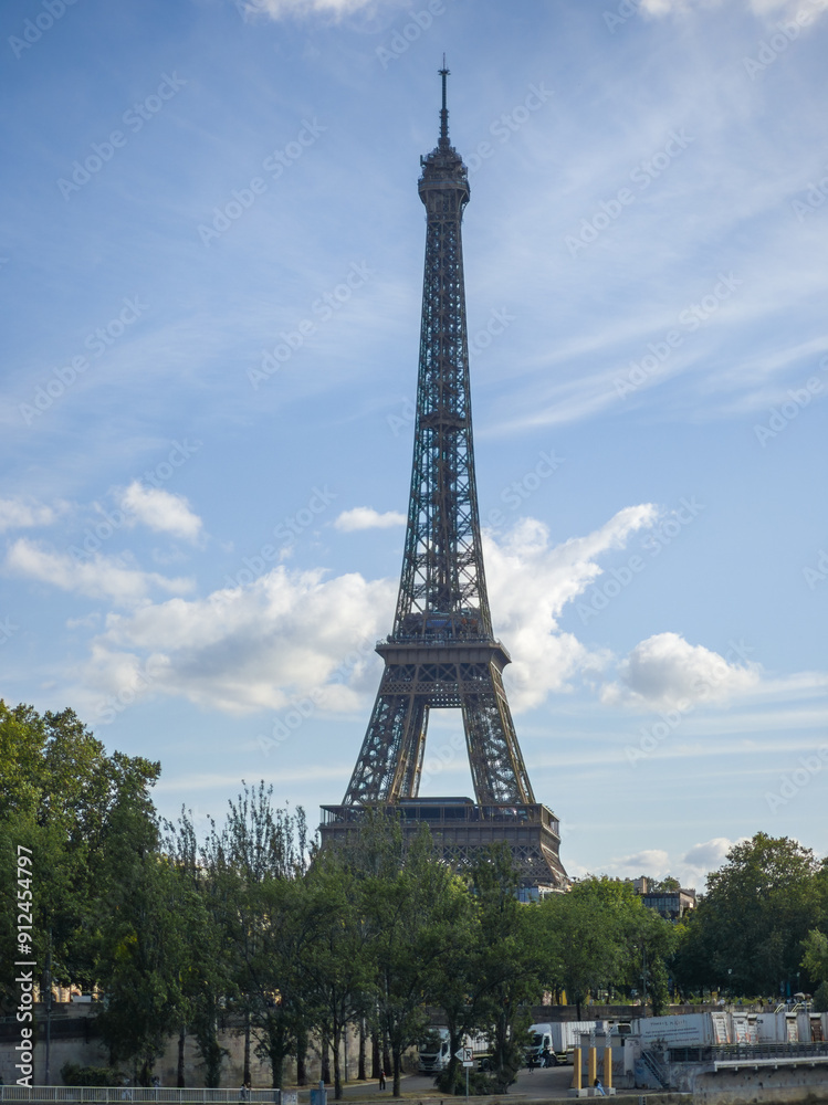 Eiffel Tower Against Blue Sky with Cloudy Background