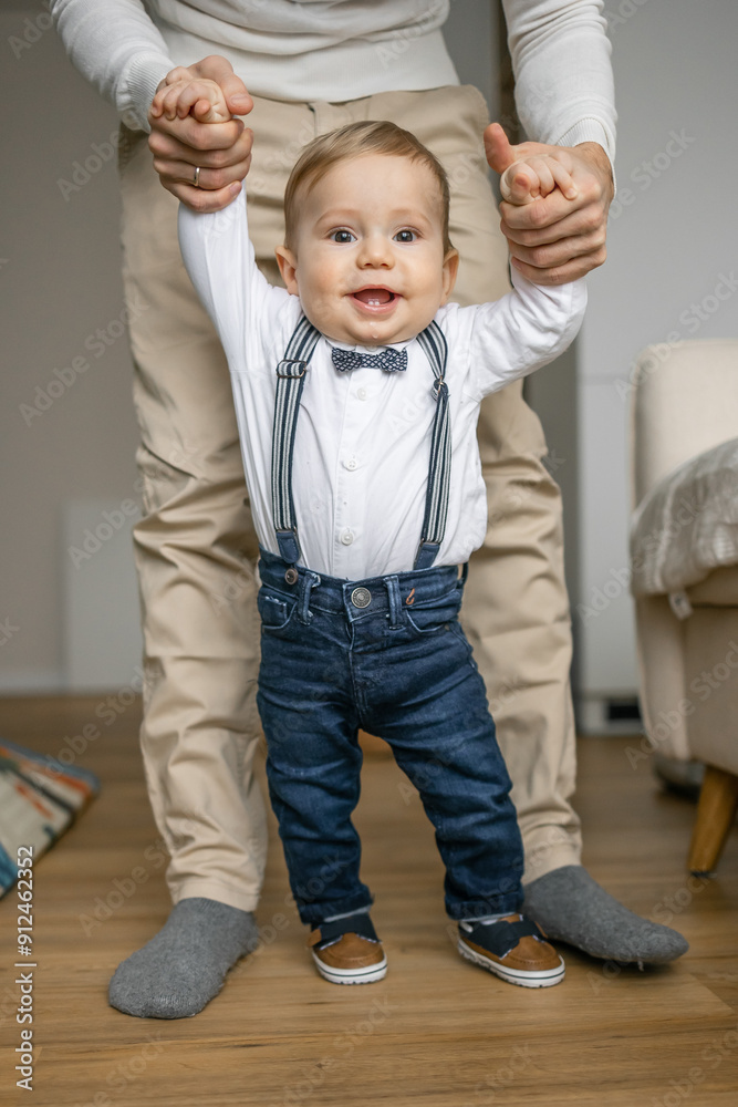 Adorable Baby Boy Learning to Walk with Parent's Help Adorable Baby Boy Learning to Walk with Parent's Help