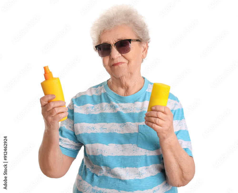 Senior woman with bottles of sunscreen cream on white background Senior woman with bottles of sunscreen cream on white background