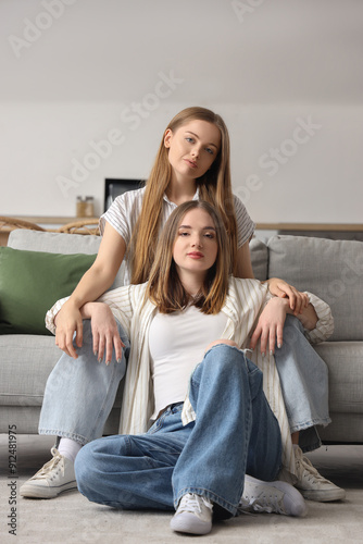 Young lesbian couple sittin...