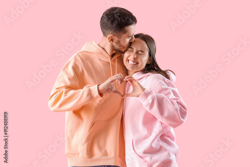 Happy young couple making h...