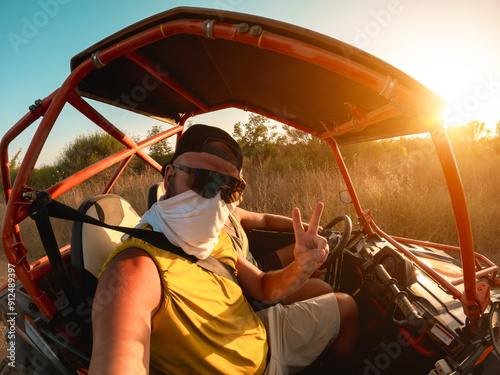 Men tourist having fun doing selfie during summer buggy tour - Travel, vacation and wild experience concept - Main focus on male face