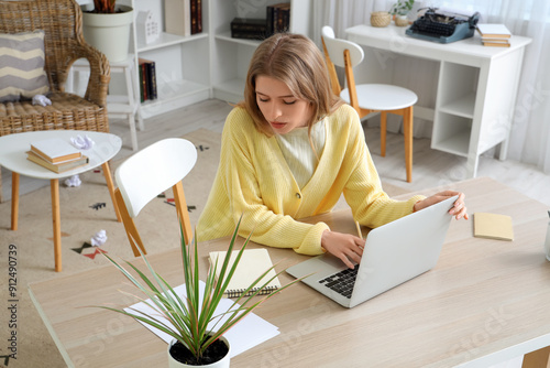 Female author using laptop ...