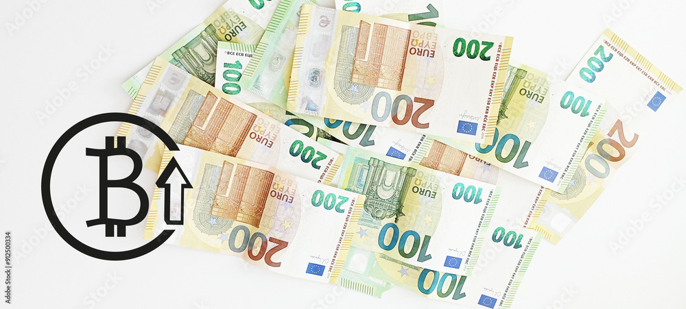 Crypto currency concept - A bitcoin with euro bills, 100 euro and 200 euro banknotes Crypto currency concept - A bitcoin with euro bills, 100 euro and 200 euro banknotes