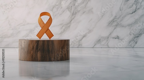 Orange Awareness Ribbon Presented on a Wooden Base Against Marble Background Multiple sclerosis photo