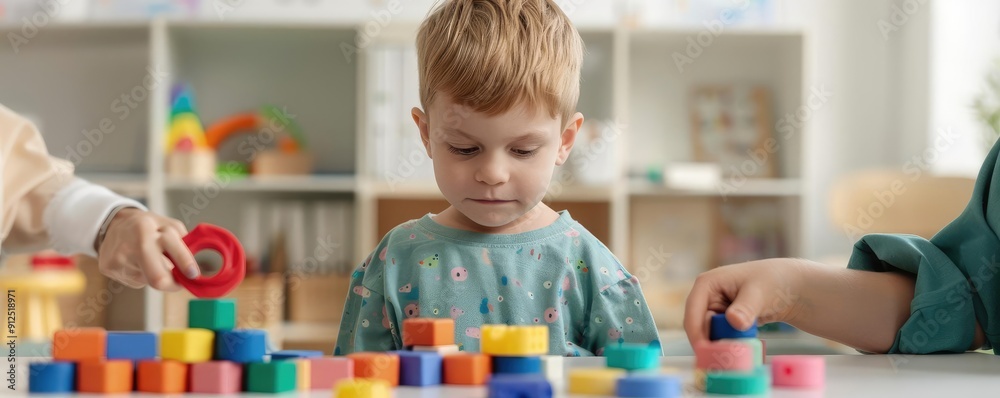 Fototapeta premium Therapist guiding autistic child through sensory activities, colorful textures, engaged play, developmental support, inclusive environment, focused care, tactile exploration