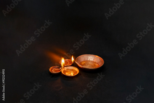 Diwali Celebration and Deepavali Tihar Hindu Festival with Diya Lamp Diyo in Dark Background photo