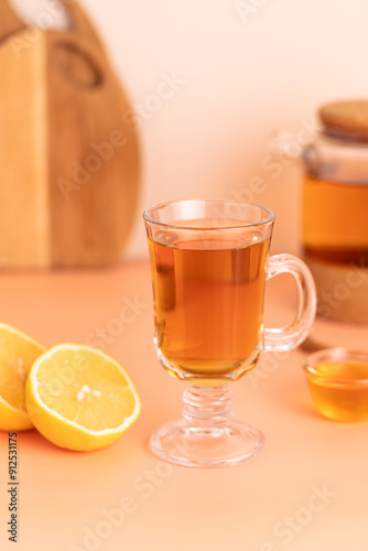 tea with lemon and honey, beige background