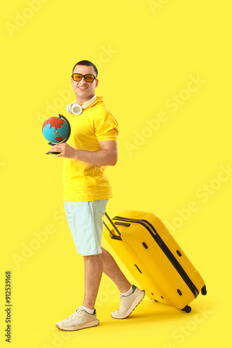 Male tourist with globe and...