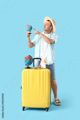 Male tourist with globes an...