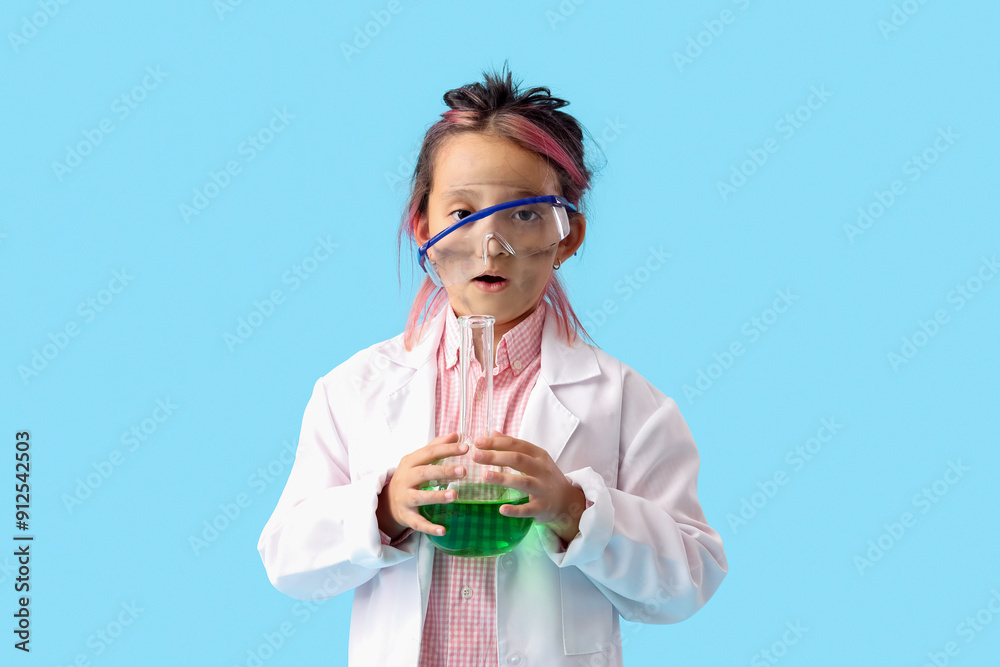 Surprised little girl with dirty face after explosion during chemistry experiment on blue background Surprised little girl with dirty face after explosion during chemistry experiment on blue background