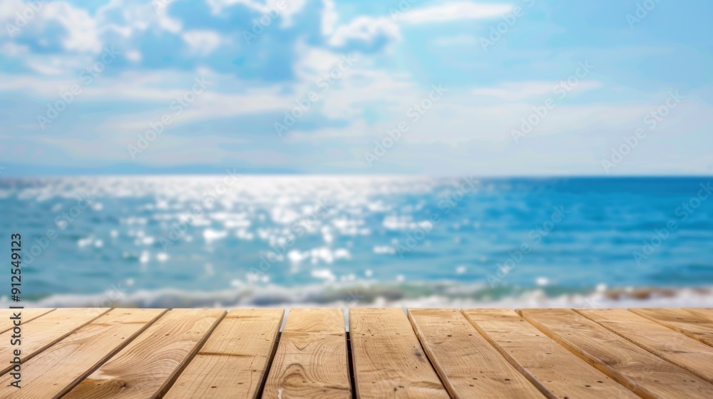 Wooden Deck Overlooking a Blue Ocean with a Blurred Background Wooden Deck Overlooking a Blue Ocean with a Blurred Background