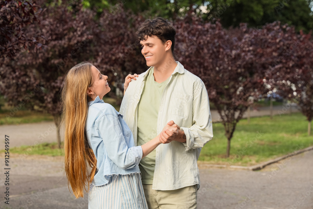 Beautiful young happy couple in summer park Beautiful young happy couple in summer park
