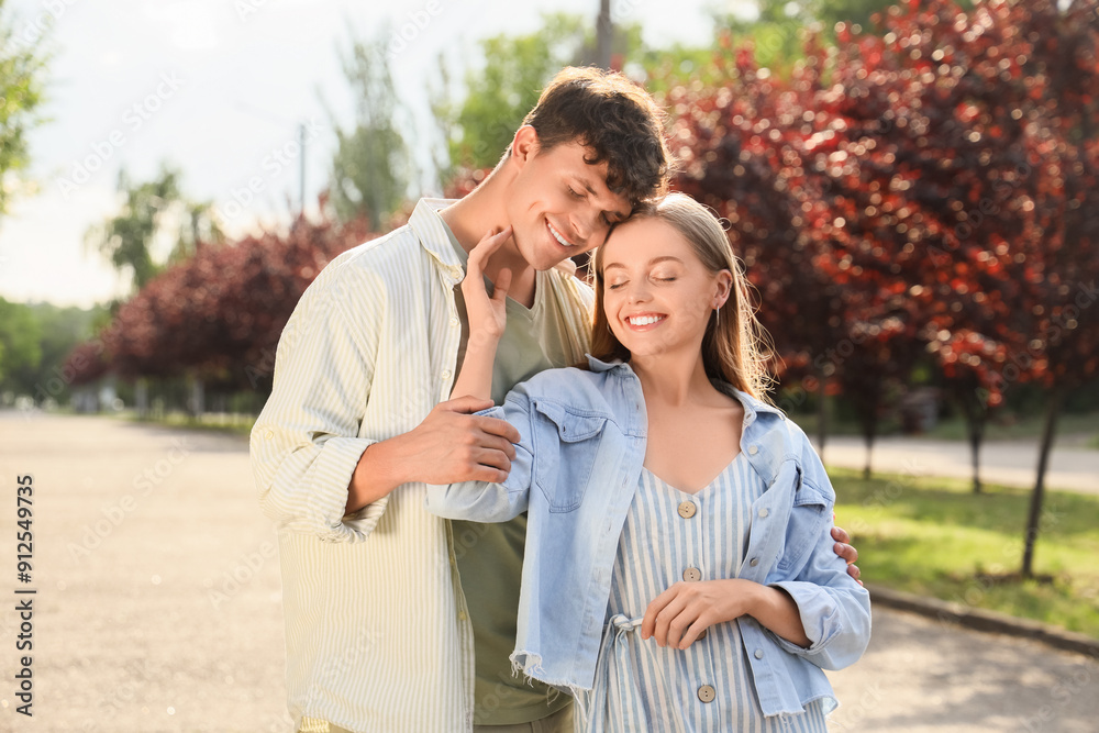 Beautiful young happy couple in summer park Beautiful young happy couple in summer park