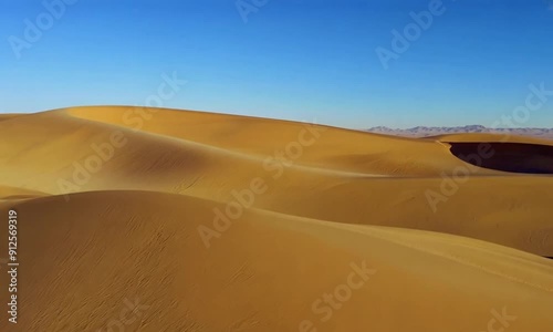 Wallpaper Mural Expansive view of golden sand dunes stretching into the distance under a clear blue sky, showcasing the vast and arid beauty of the desert landscape Torontodigital.ca