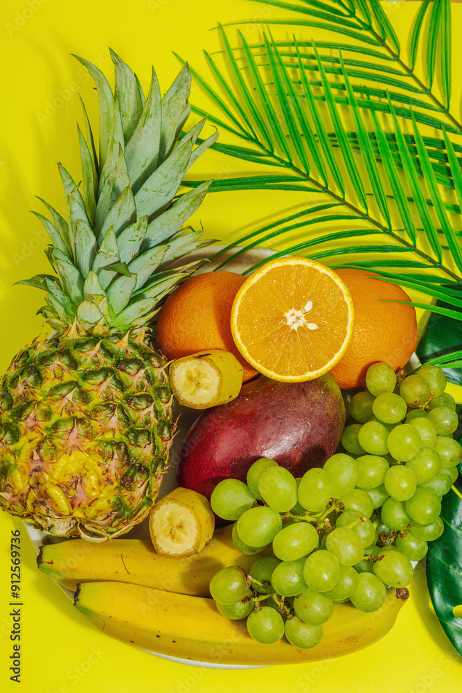 Set of fresh tropical fruits. Ripe mangoes, pineapple, oranges, grapes and bananas Set of fresh tropical fruits. Ripe mangoes, pineapple, oranges, grapes and bananas
