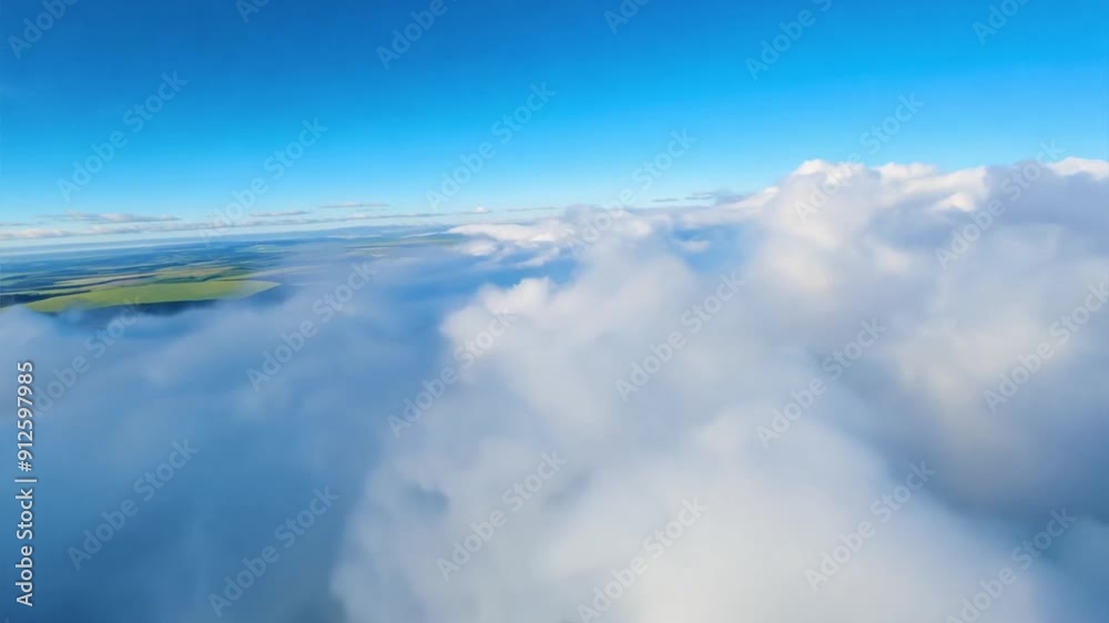 Flying above clouds in the sky view on green fields below
