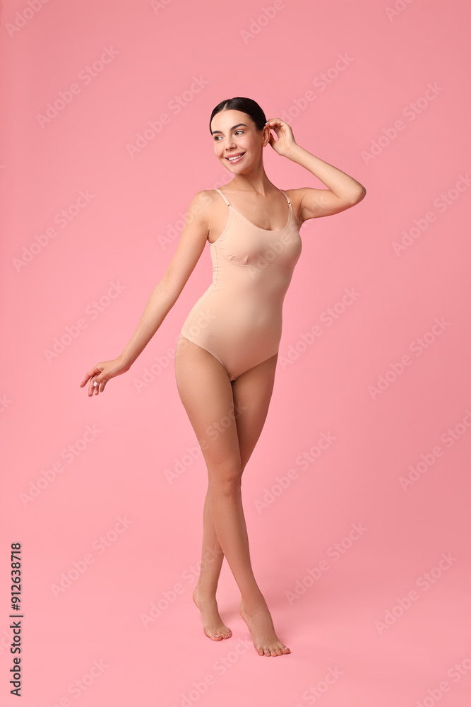Fototapeta premium Smiling woman with perfect skin on pink background. Body care