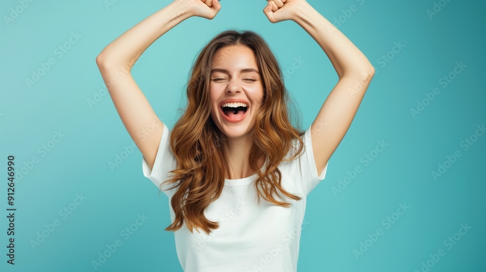 Exultant young woman celebrating getting a job. Exultant young woman celebrating getting a job.