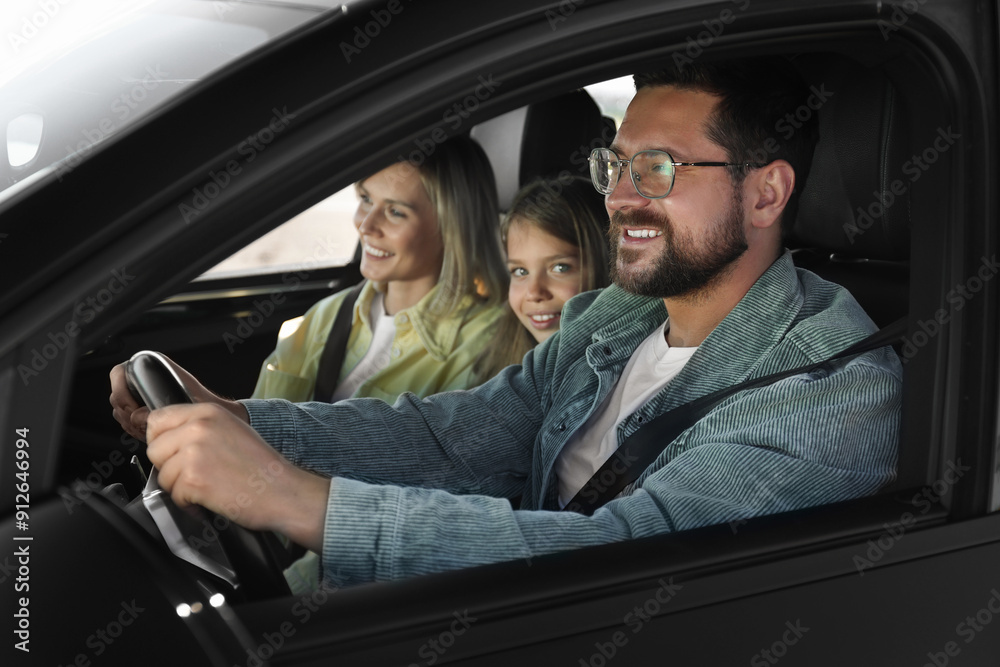 Happy family enjoying trip together by car, view from outside Happy family enjoying trip together by car, view from outside