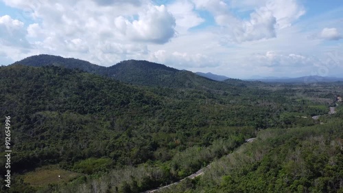 Natural scenery of the mountains and the waters of Riam Kanan in Banjarbaru, South Kalimantan with a background of sky and clouds photo