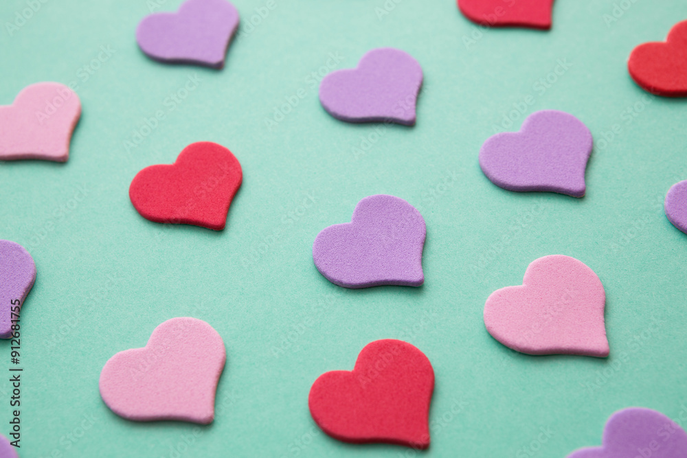 Fototapeta premium Pink and purple hearts on green background, love and relationship design element