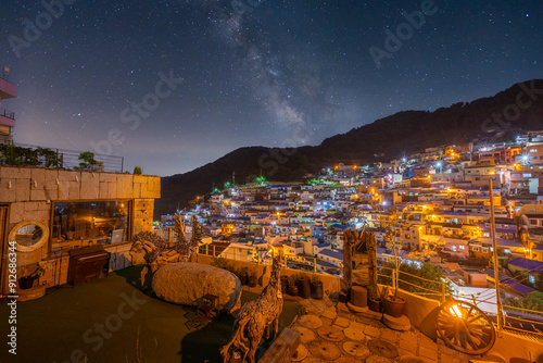 Gamcheon Culture Village at Night in Busan and the Milky Way in the background, Busan, South Korea. photo