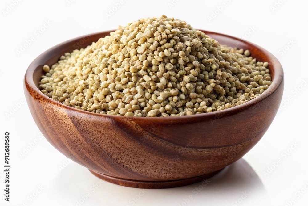 A heap of organic hemp seeds in a bowl, isolated on a pristine white background, beautifully lit to showcase their natural texture and earthy tones. A heap of organic hemp seeds in a bowl, isolated on a pristine white background, beautifully lit to showcase their natural texture and earthy tones.