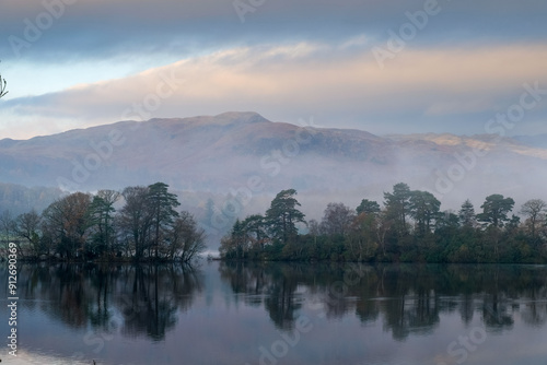 Sunrise over the lake in the mountains of the Lake District National Park photo