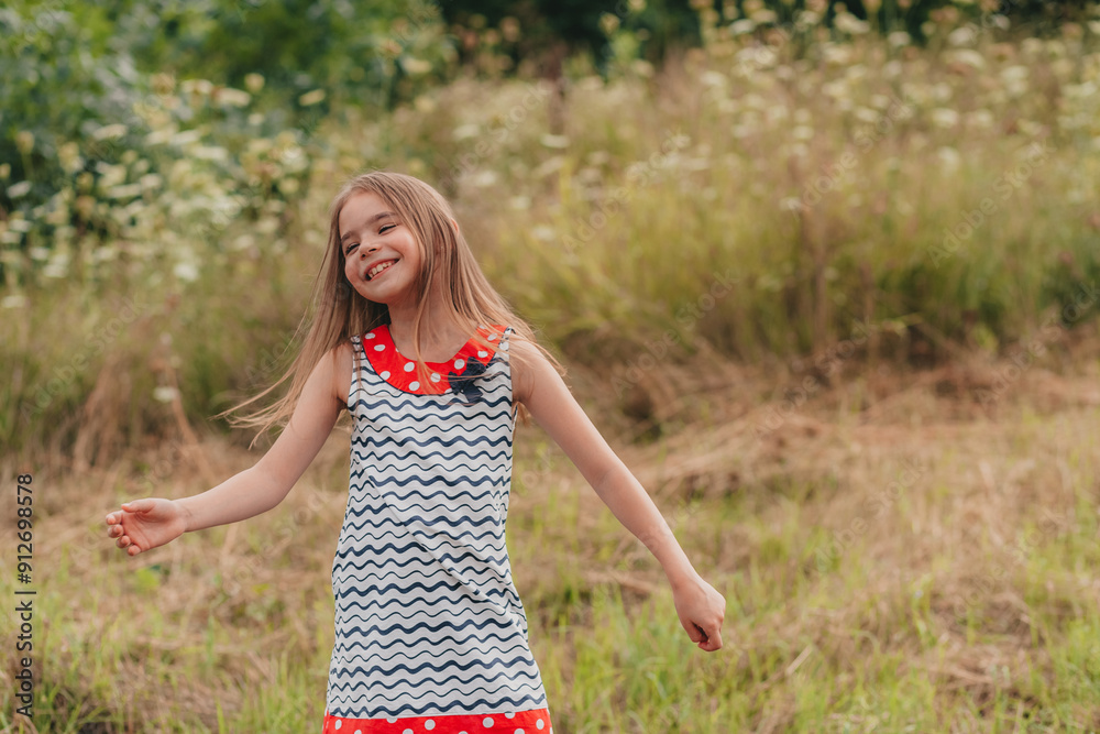 A beautiful girl is having fun and jumping on a green meadow A beautiful girl is having fun and jumping on a green meadow