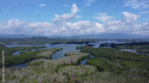 Natural scenery of the mountains and the waters of Riam Kanan in Banjarbaru, South Kalimantan with a background of sky and clouds photo