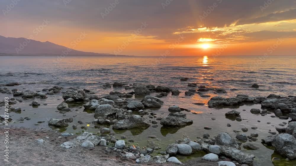 Experience the Tranquil and Beautiful Sunset Over the Rocky Shoreline at Lake Experience the Tranquil and Beautiful Sunset Over the Rocky Shoreline at Lake