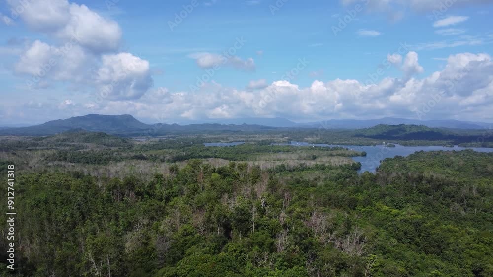Natural scenery of the mountains and the waters of Riam Kanan in Banjarbaru, South Kalimantan with a background of sky and clouds Natural scenery of the mountains and the waters of Riam Kanan in Banjarbaru, South Kalimantan with a background of sky and clouds
