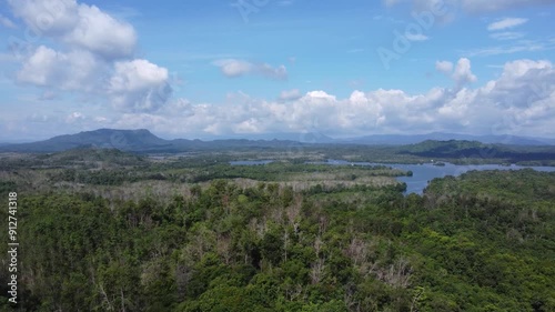 Natural scenery of the mountains and the waters of Riam Kanan in Banjarbaru, South Kalimantan with a background of sky and clouds photo