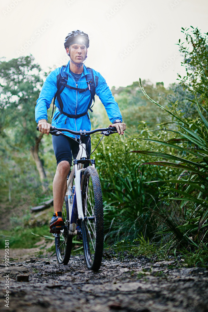 Fototapeta premium Man, action and mountain terrain or cycling in outdoor, performance and extreme sports. Male person, athlete and training in nature for triathlon, bicycle and riding exercise for fitness challenge